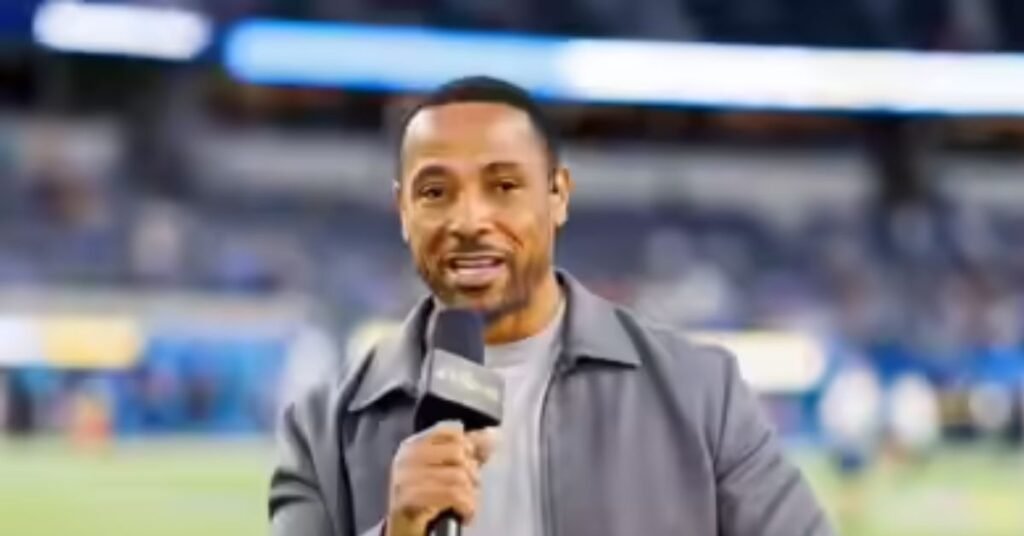 Close-up of NFL analyst Rodney Harrison during a broadcast, looking focused with a microphone headset on.